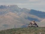 Summit cairn ,Great Mell Fell with Blencathra in the distance.