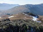 Looking back down the ridge to the long curving bulk of Hard Knott and Border End in the mid distance.