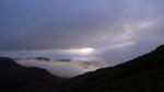 The sun trying to break through the shifting layers of cloud and fog.